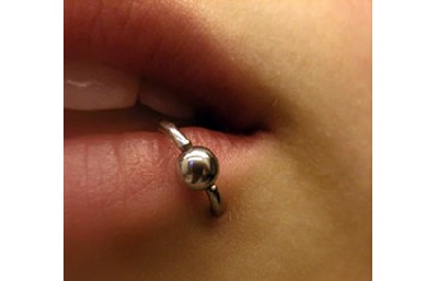 Quais os tipos de piercing na boca mais danosos à saúde bucal?